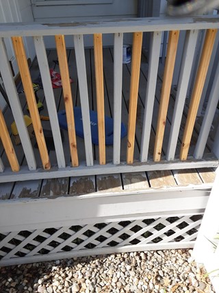 Customer's porch railing and trellis before repainting in Niskayuna, NY
