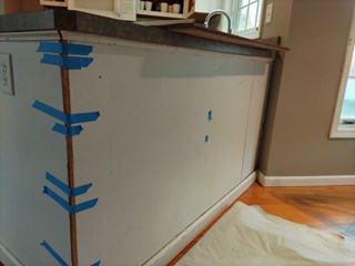 Kitchen Island in Latham damaged by an appliance installer taped by customer.