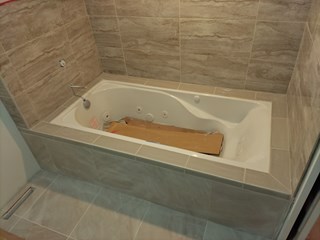 After Handyman Pete completed the tile for the tub in Stillwater.