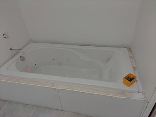 Newly installed tub in Stillwater in need of a beautiful finish.