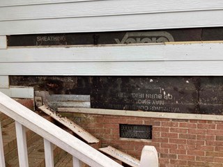 Rotted siding before repair. 