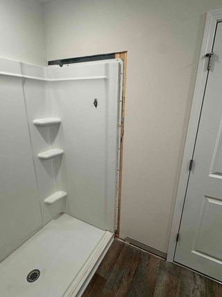 Cutout drywall after a shower installation.  
