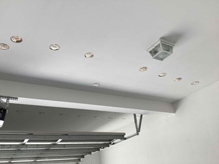 Cutout drywall holes after can light removal in Clayton NC. 