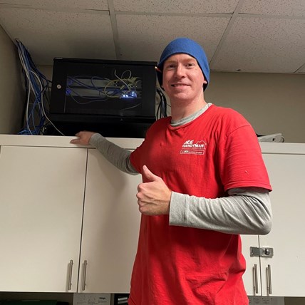 Our craftsman Ethan, after completing a commercial IT cabinet installation in a Garner, NC office. Our craftsman Ethan, after completing a commercial IT cabinet installation in a Garner, NC office.