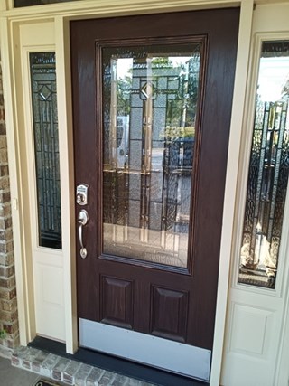 Exterior door paint before in Leland
