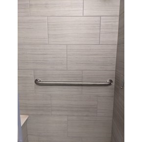 Grab bar installation on shower tile surround. Grab bar installation on shower tile surround.