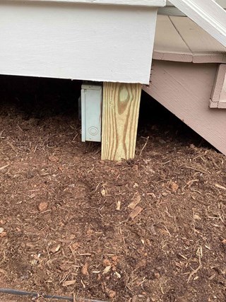 Damaged post has been replaced. The new post is made of fresh, untreated wood, and the structure now looks more solid and secure.
