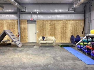 The plastic sheeting has been covered with wooden paneling, giving the area a more polished and completed look.