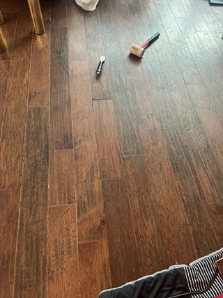 Area of flooring after several damaged boards have been replaced. 