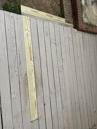 Deck after the repair, where a new piece of wood has been installed, filling the gap and restoring the integrity of the deck