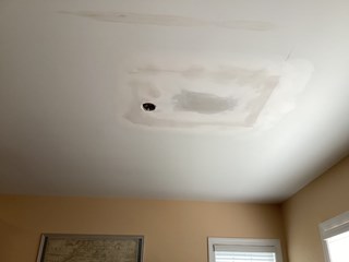 Ceiling after the hole has been patched.