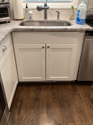 After repair the cabinet doors are now smooth, undamaged, and well-maintained, presenting a cleaner and more polished appearance.