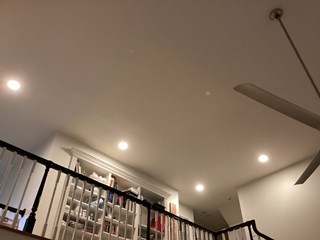 Ceiling area after the drywall has been repaired. The crack is no longer visible, and the ceiling looks smooth and clean after it was restored to its original condition.
