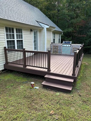 Deck after it has been refinished, with a fresh coat of stain applied. 