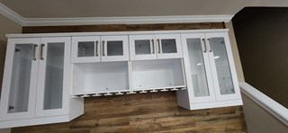  The cabinets are now mounted on the wall, with doors and handles in place. 