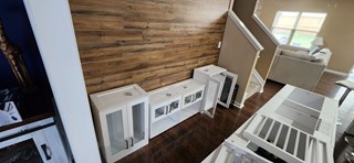 A room showing the area where cabinetry is being prepared for installation. 
