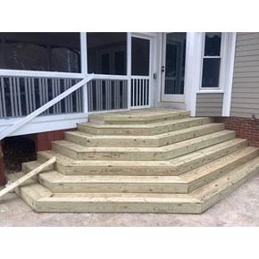 Newly repaired wooden stairway leading to a 3 season room.  