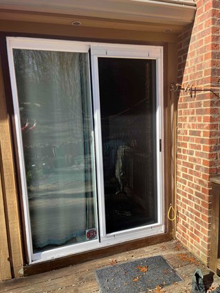 Home improvement in Pittsboro, NC: Completed sliding glass door replacement. After photo highlighting the beautiful new door and the improved view and natural light it brings.