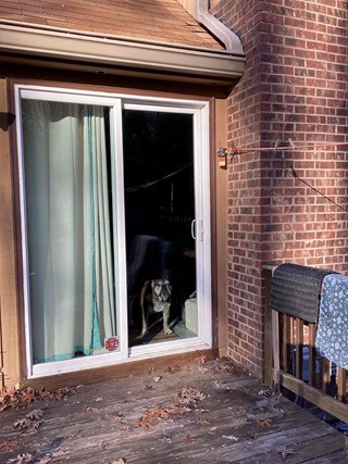 Pittsboro, NC sliding glass door replacement: A close-up of an old sliding glass door, showcasing the need for a modern and energy-efficient replacement."