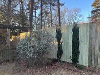 Newly repaired wood fence in Raleigh 27613 