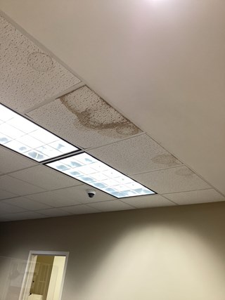 Water-damaged ceiling tile in an a commercial space