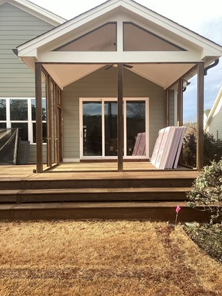 Screened porch to sunroom conversion showing new framing, windows, and door installation in Fuquay Varina NC 27526