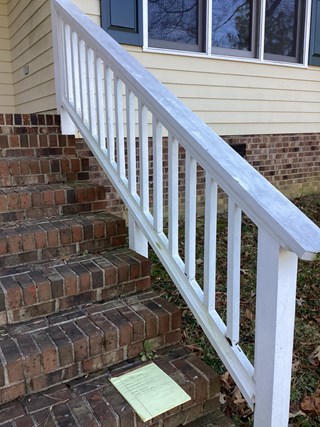 Exterior wood railing in Wake Forest before repair