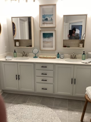 Professional cabinet handle and knob installation on a double sink bathroom vanity.