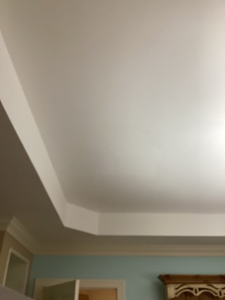  Completed ceiling repair and painting project in Cary, NC. Smooth, white ceiling with crown molding.