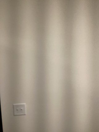 Empty wall in Raleigh, NC ready for professional TV mounting service.