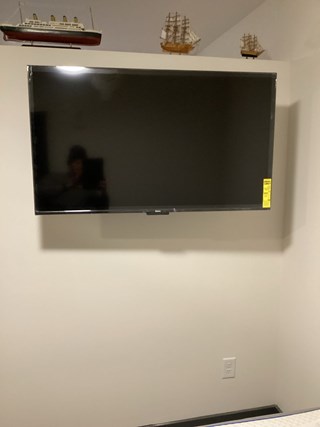 Wall-mounted TV installation service in North Hills completed successfully.