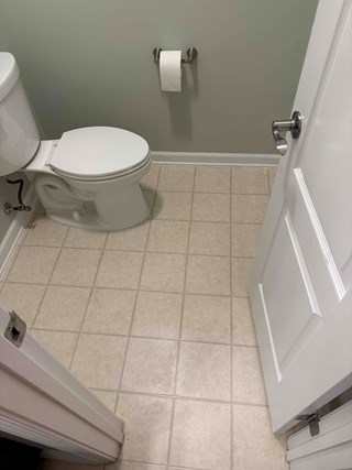 Depiction of the original bathroom in a Raleigh, NC home before a remodeling project, showcasing the existing layout and finishes.
