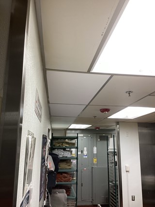 After photo of replaced ceiling tiles in a Morrisville, NC restaurant kitchen, addressing previous water damage.
