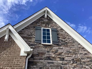 After photo of a storm-damaged shutter repaired in Wake Forest, NC.