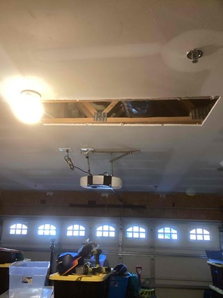 Large-Hole-in-ceiling-drywall-above-garage
