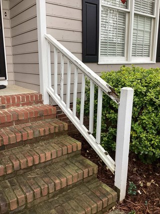 wooden-railing-with-significant-damage-visible