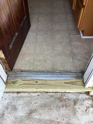 New-wooden-door-threshold-after-carpentry-repair
