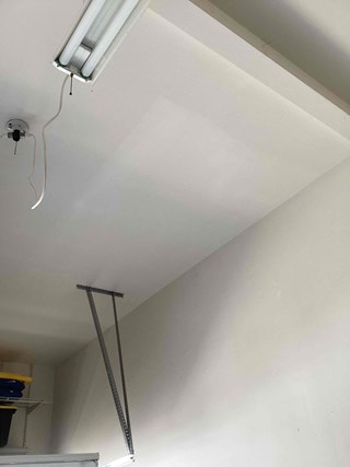 Garage-ceiling-drywall-after-professional-repair