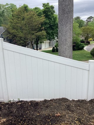 Vinyl fence after repair of the top section 