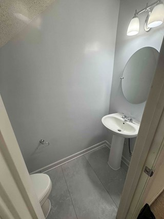 Half bath renovation completed with new flooring, pedestal sink and new paint Fuquay-Varina NC 27526