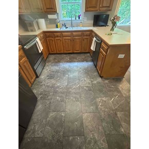 Completed grey porcelain kitchen floor tile in Clayton NC 27527