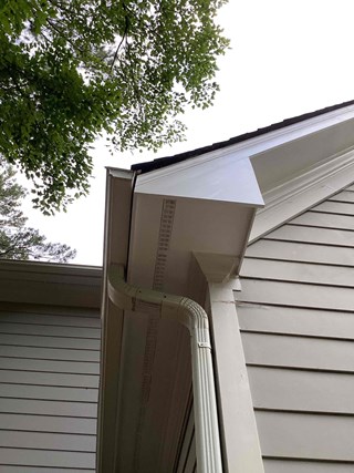 Wood fascia has been repaired and painted a fresh coat of white after professional carpentry repair in Fuquay Varina NC 27526