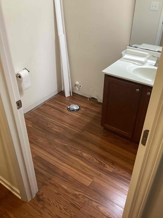 Completed wood floor repairs in the bathroom after Ace Handyman Services Repairs in Durham NC 27703