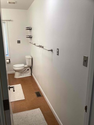 Completed bathroom renovation in Chapel Hill NC 27514 with drywall repairs and a fresh coat of paint. 
