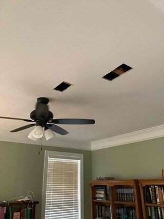 Ceiling with cutout holes before drywall repair and painting in home office with ceiling fan in Holly Springs, NC 27540 by Ace Handyman Services handyman.