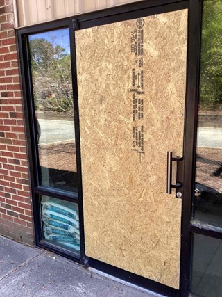 Commercial-glass-door-boarded-up