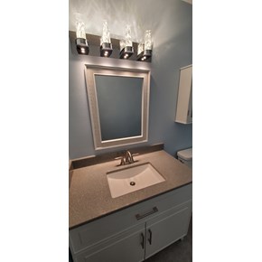 Ace Handyman Services completed a bathroom remodel in Westerville, Ohio using Onyx Collection products, Woodward cabinetry, and Delta faucet.