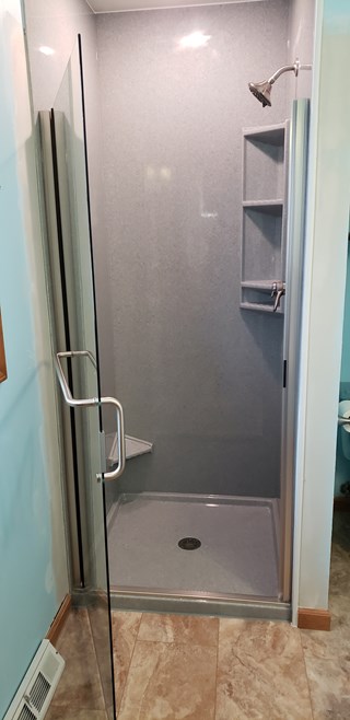 After Bathroom Remodel using Onyx Collection Products for shower including shower walls, base, and accessories in Blacklick, Ohio