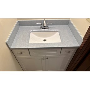 Ace Handyman Services installed an Onyx Collection countertop with integrated sink, new vanity, and delta faucet in Columbus, Ohio.