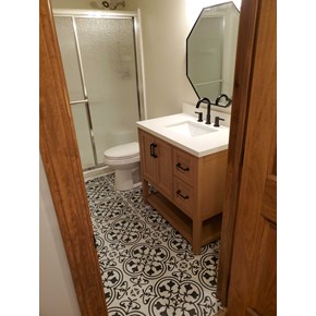 Basement Bathroom Refresh including new flooring, sink, vanity, and mirror in Sunbury, Ohio